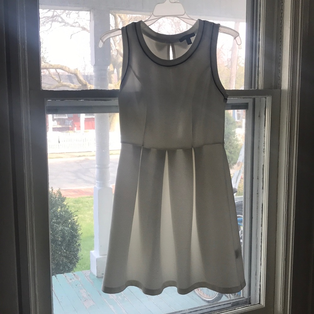 White and blue trimmed dress with bows on back